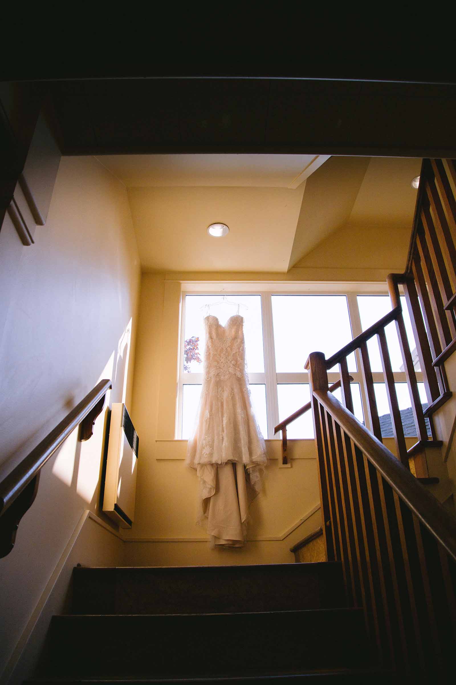 wedding dress up a large pair of stairs
