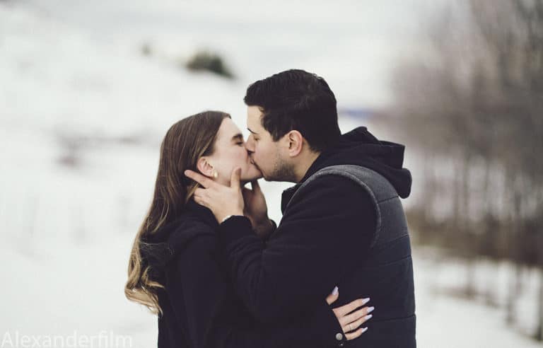 couple kissing in the snow