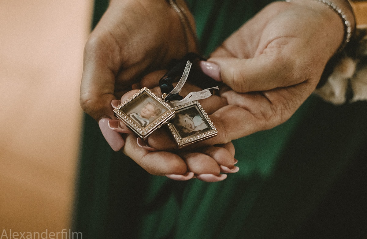 a woman holding small pictures in her hands