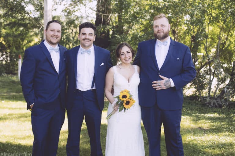 a bride with 3 groomsman beside her
