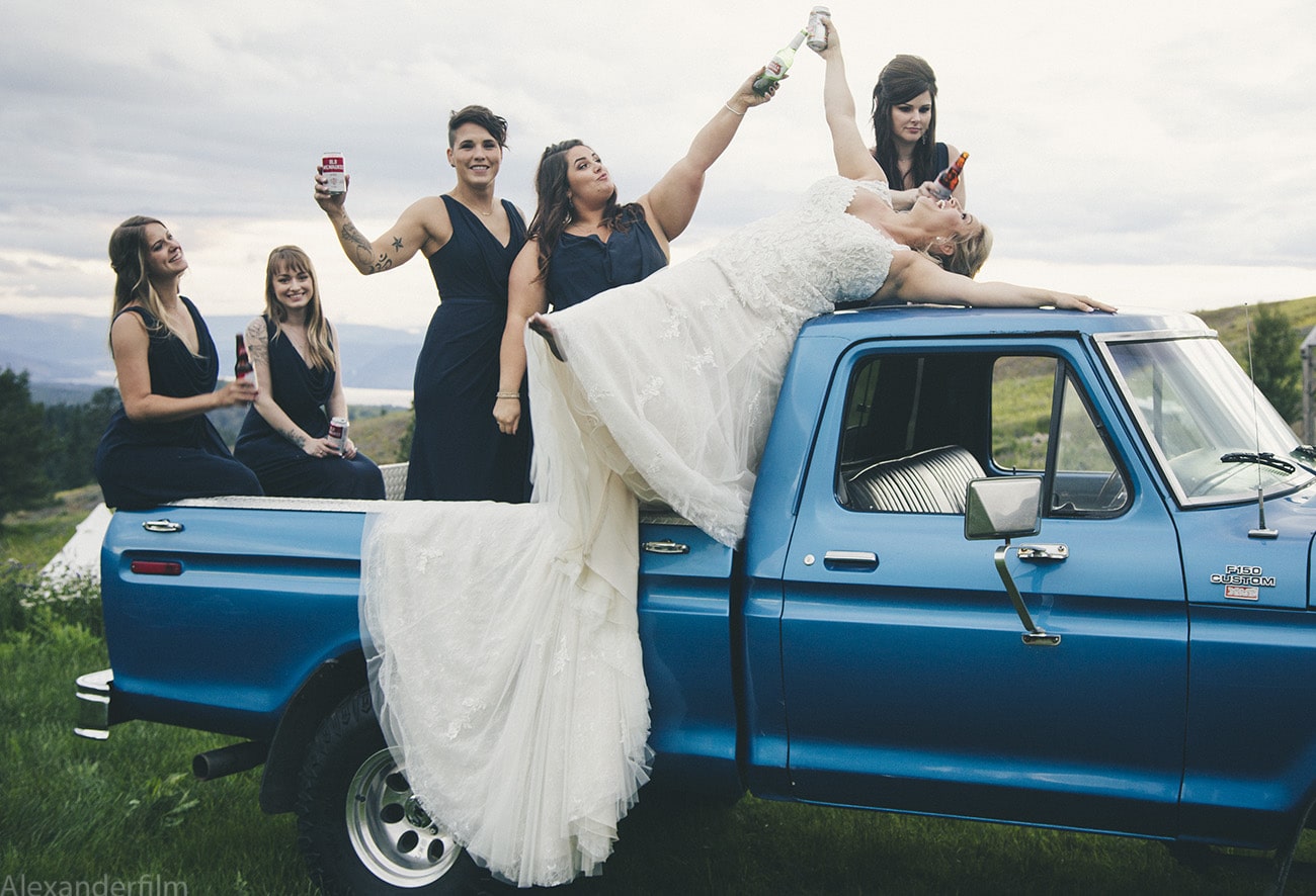 bride and bridesmaids on a truck acting funny