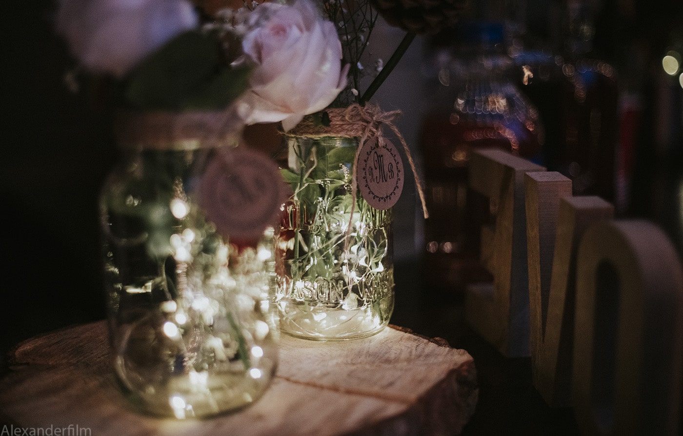mason jars with lights and flowers inside