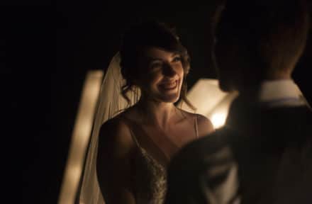 a bride smiling at her new husband