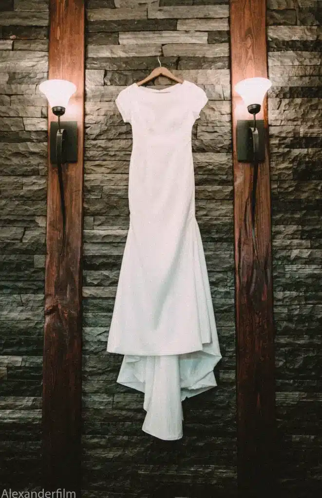 Wedding dress hanging on wall