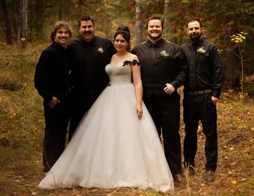groomsman with bride in the middle