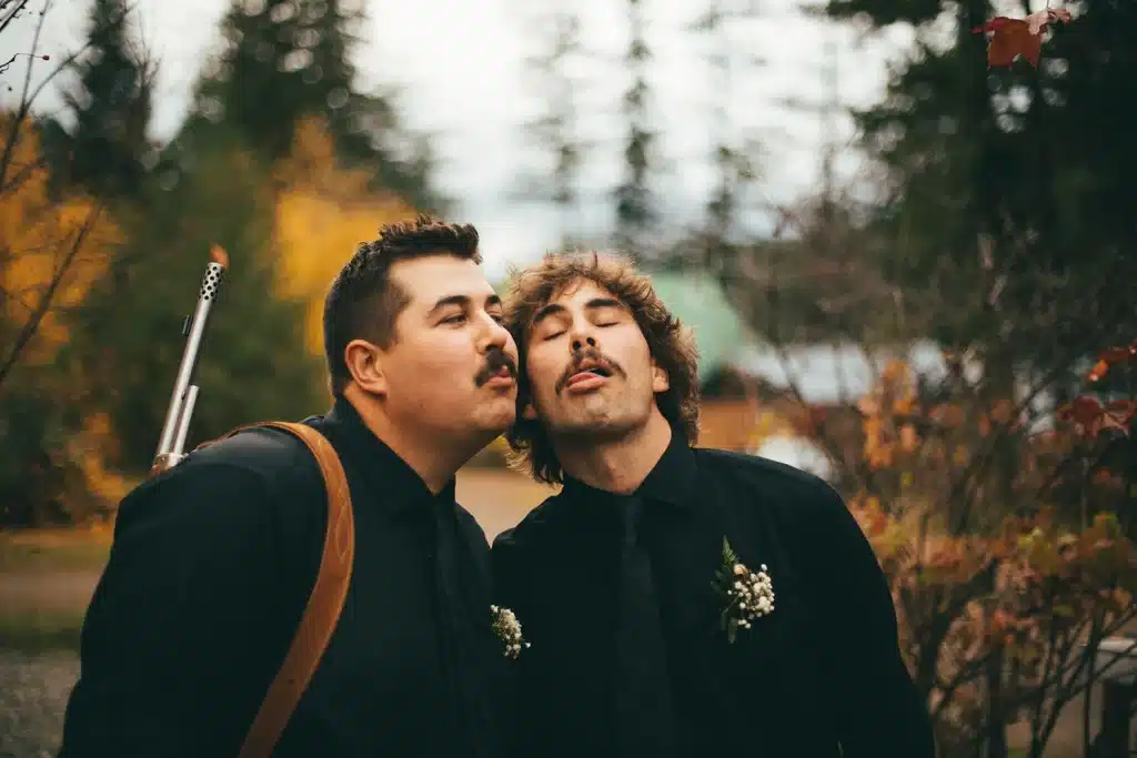 groomsman making funny faces at each other