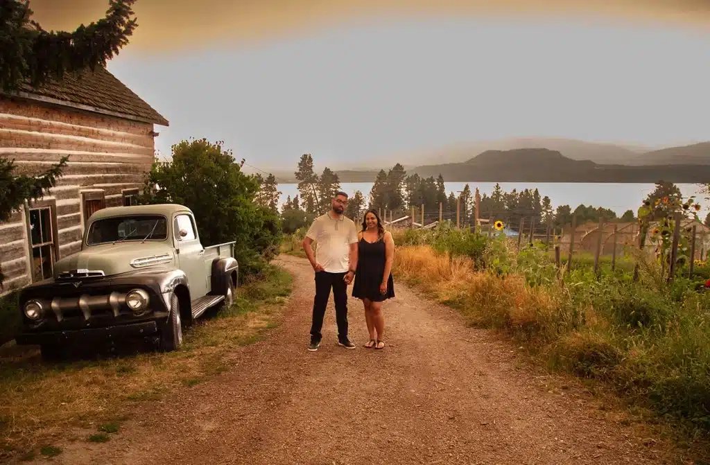 couple standing beside a vin-yard