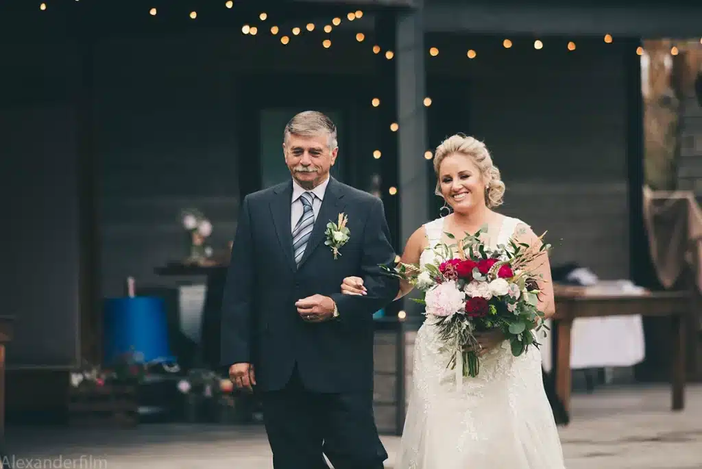 bride with her father walking down the aisle