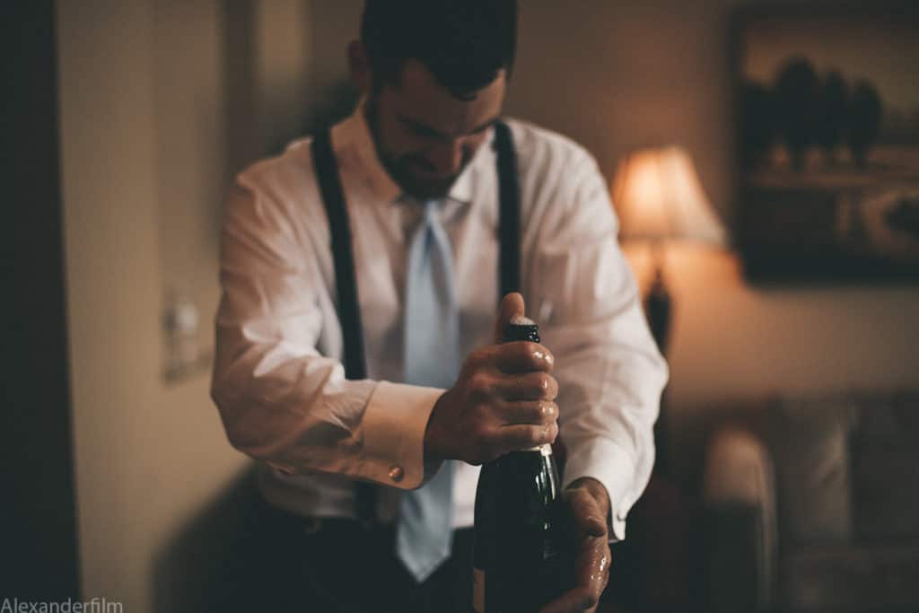 man opening bottle