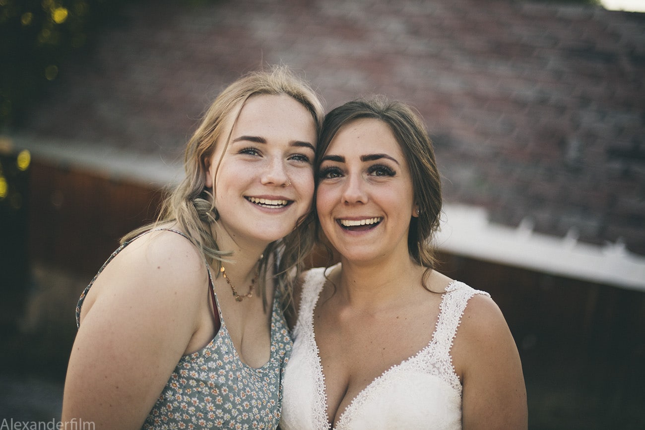 Two girls smiling at camera