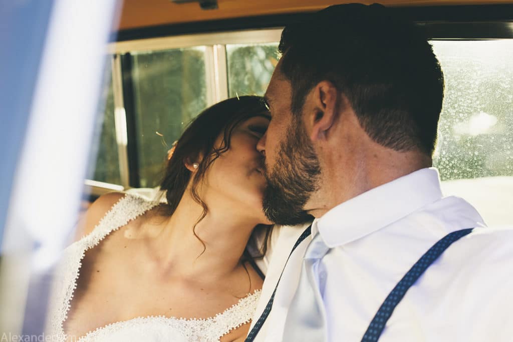 bride and groom kissing in a 1950s truck