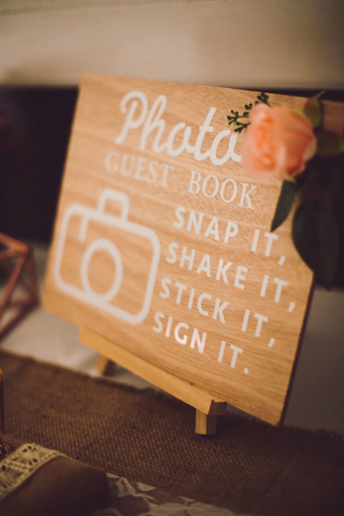 a sign stating to take a photo on a table